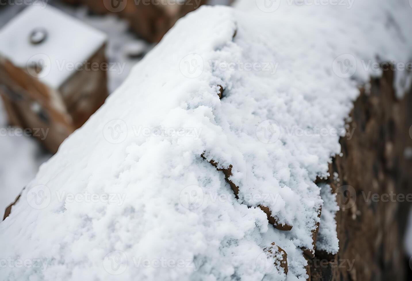 close up of snow on a wooden fence photo