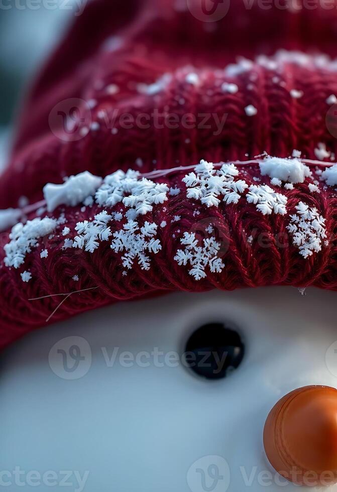 close up of a snowman wearing a red hat photo