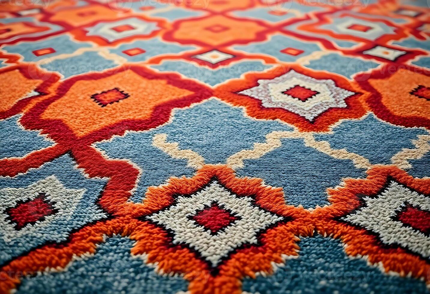 close up of a rug with an orange and blue pattern photo