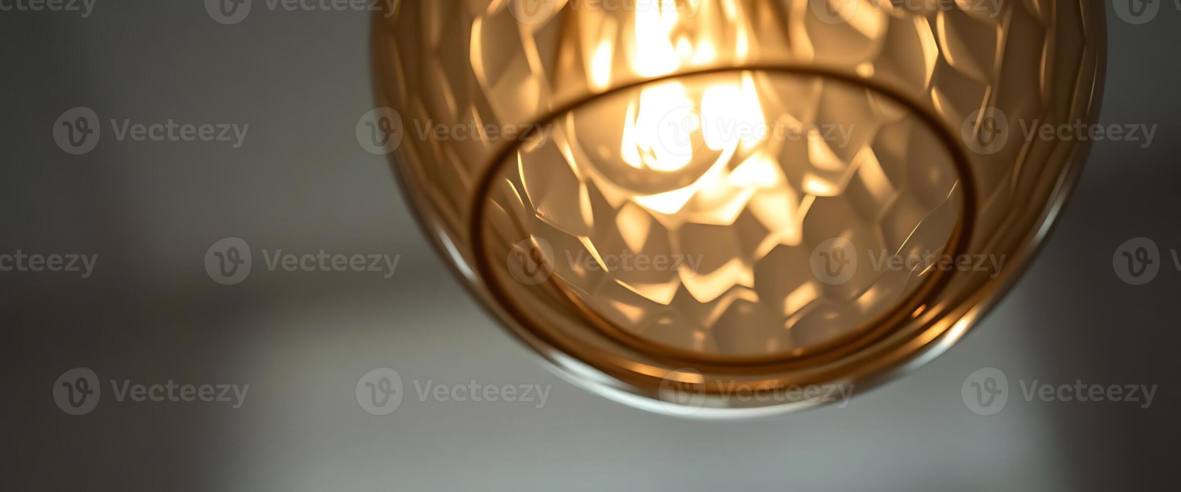 close up of a light fixture with a blurry background photo