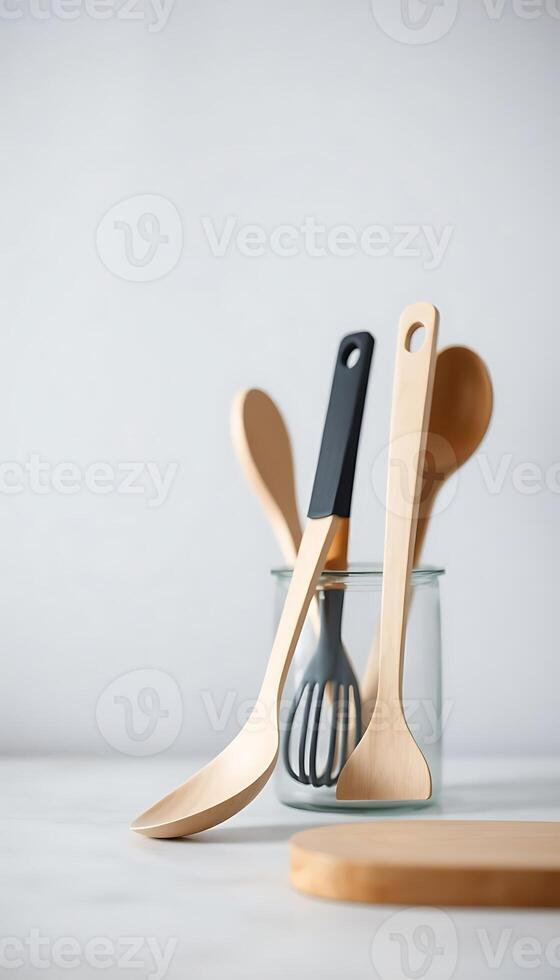 couple of wooden utensils in a glass photo