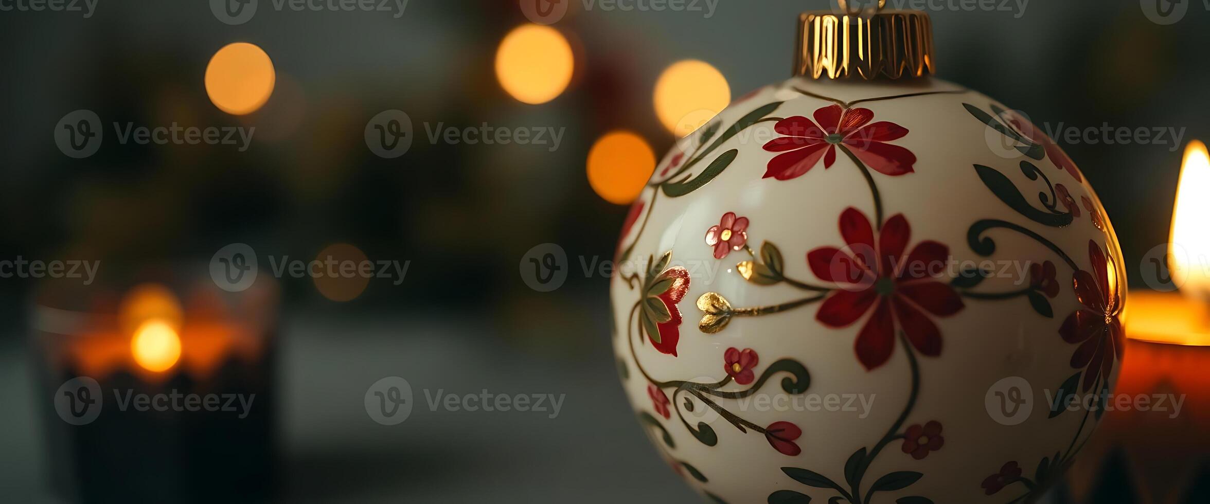 close up of a christmas ornament with candles in the background photo