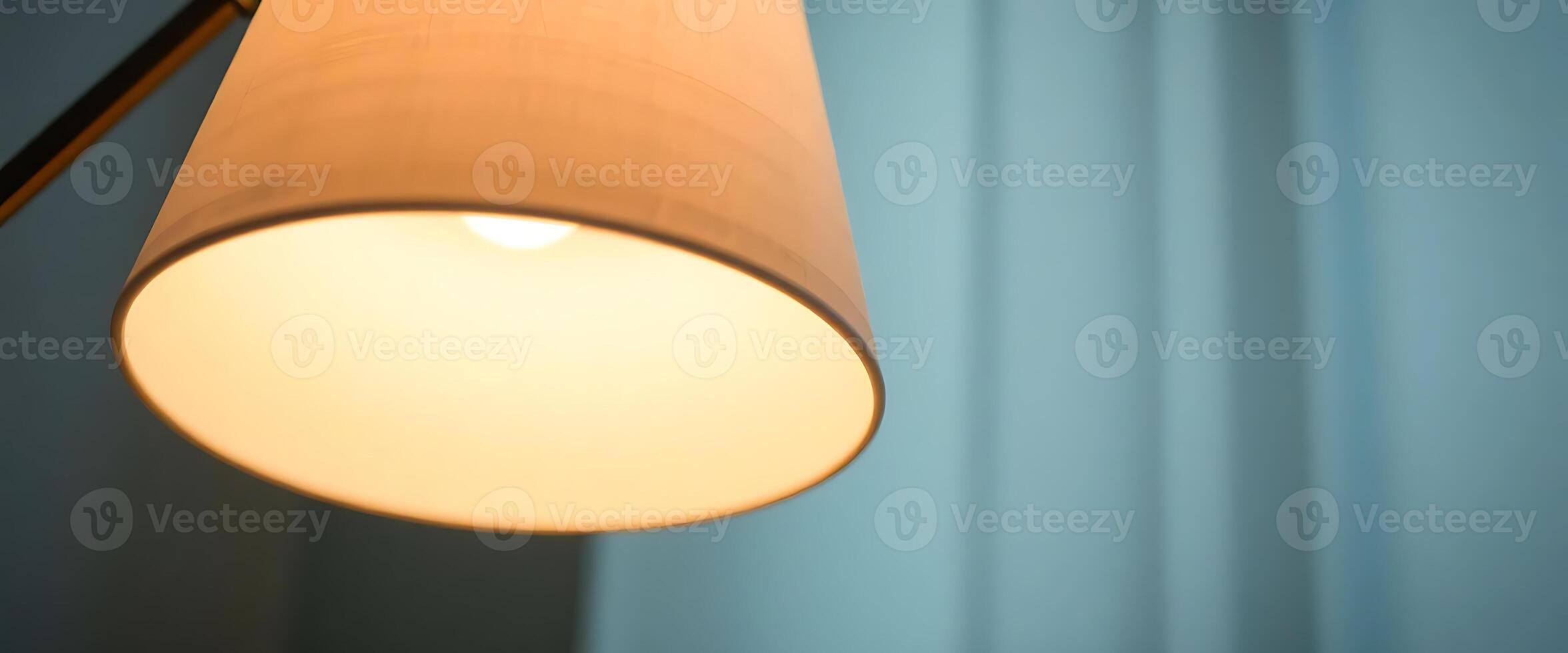 lamp that is on in a room photo