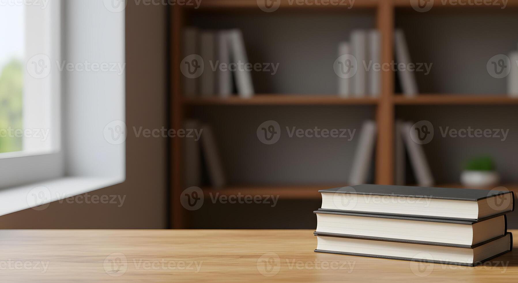 Stack of books on a wooden table in front of a window photo
