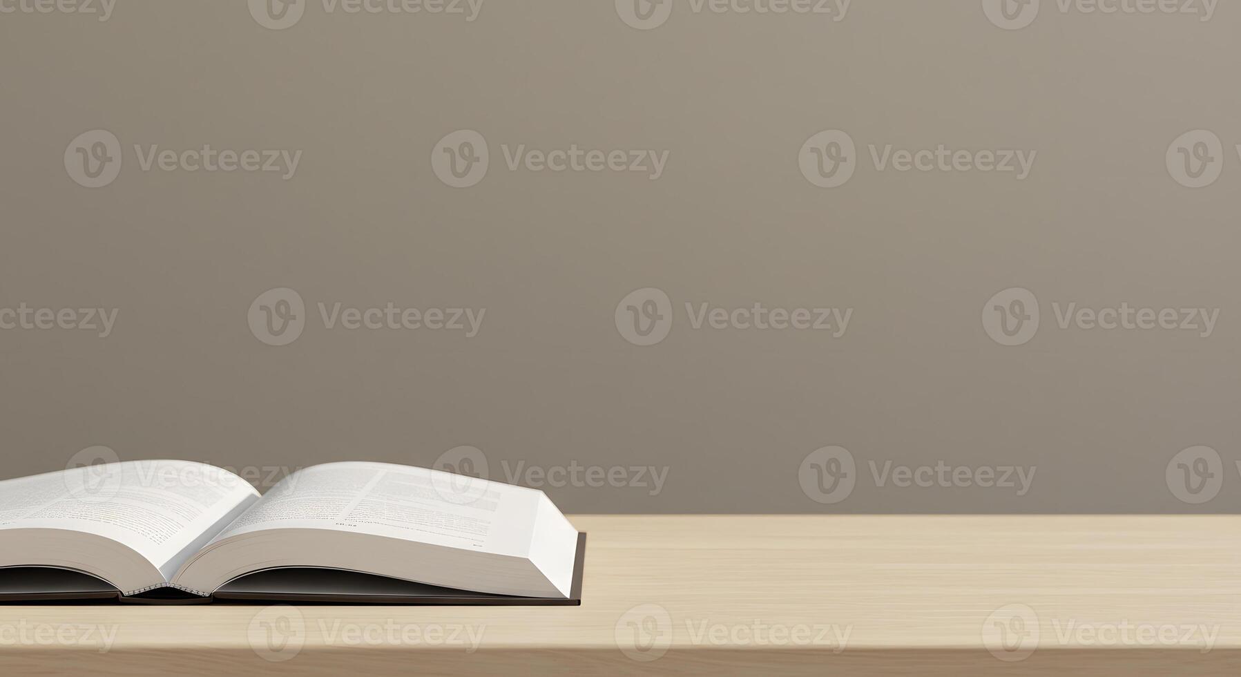 An open book on a table with a gray background photo