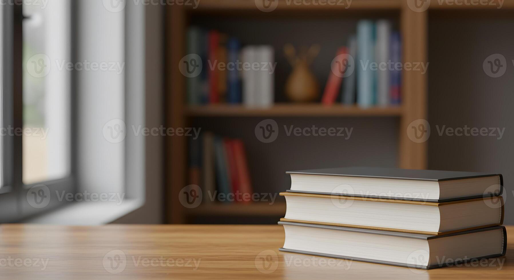 Stack of books on a wooden table in front of a bookcase photo