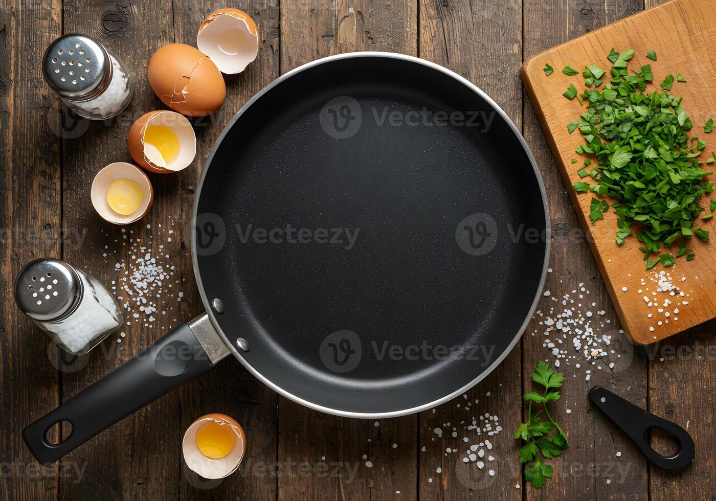 An image of a frying pan with eggs and herbs photo