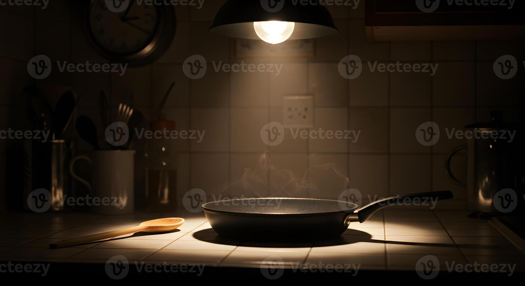 A pan on a stove with a light shining on it photo
