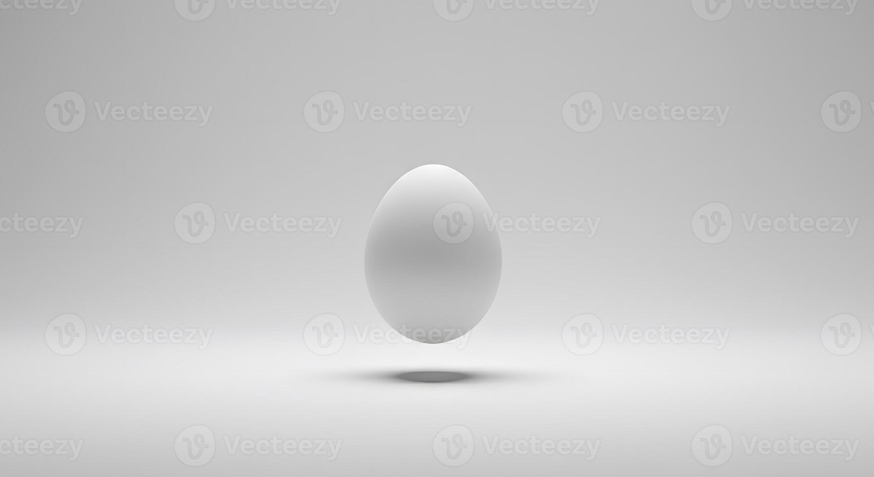 A white egg floating in the air on a gray background photo