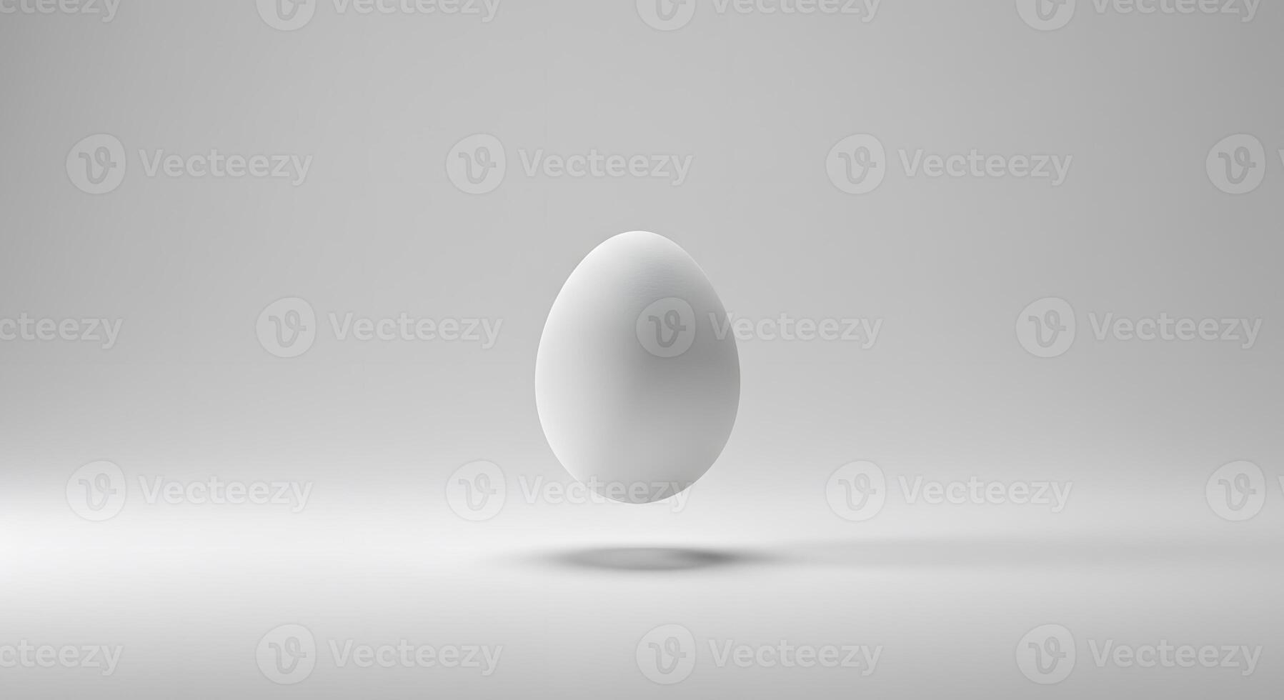 A white egg floating in the air on a white background photo