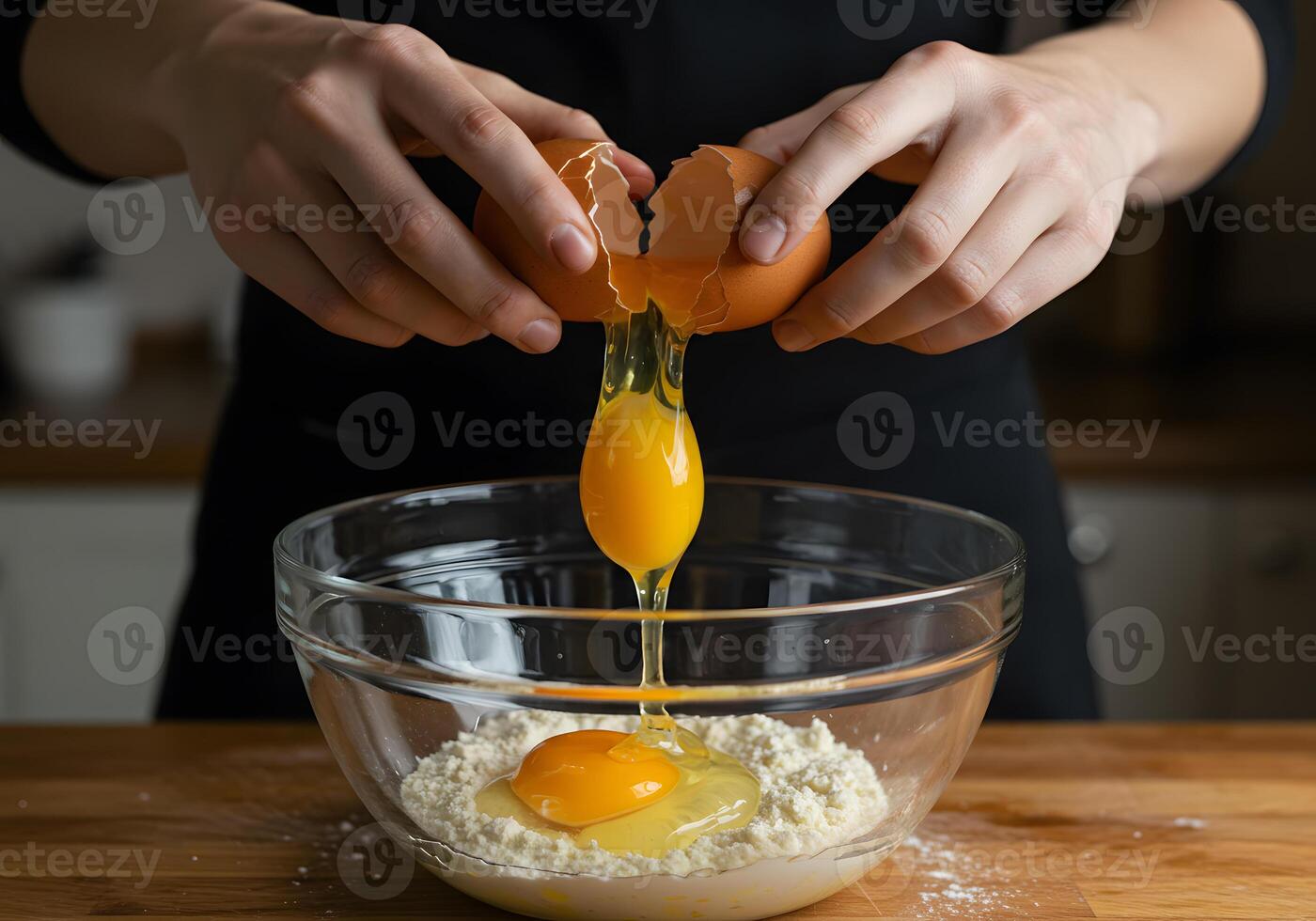 A person is peeling an egg in a bowl photo