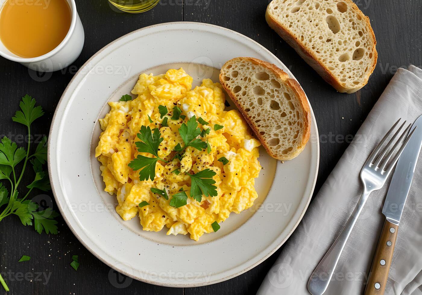 Scrambled eggs and toast on a white plate photo