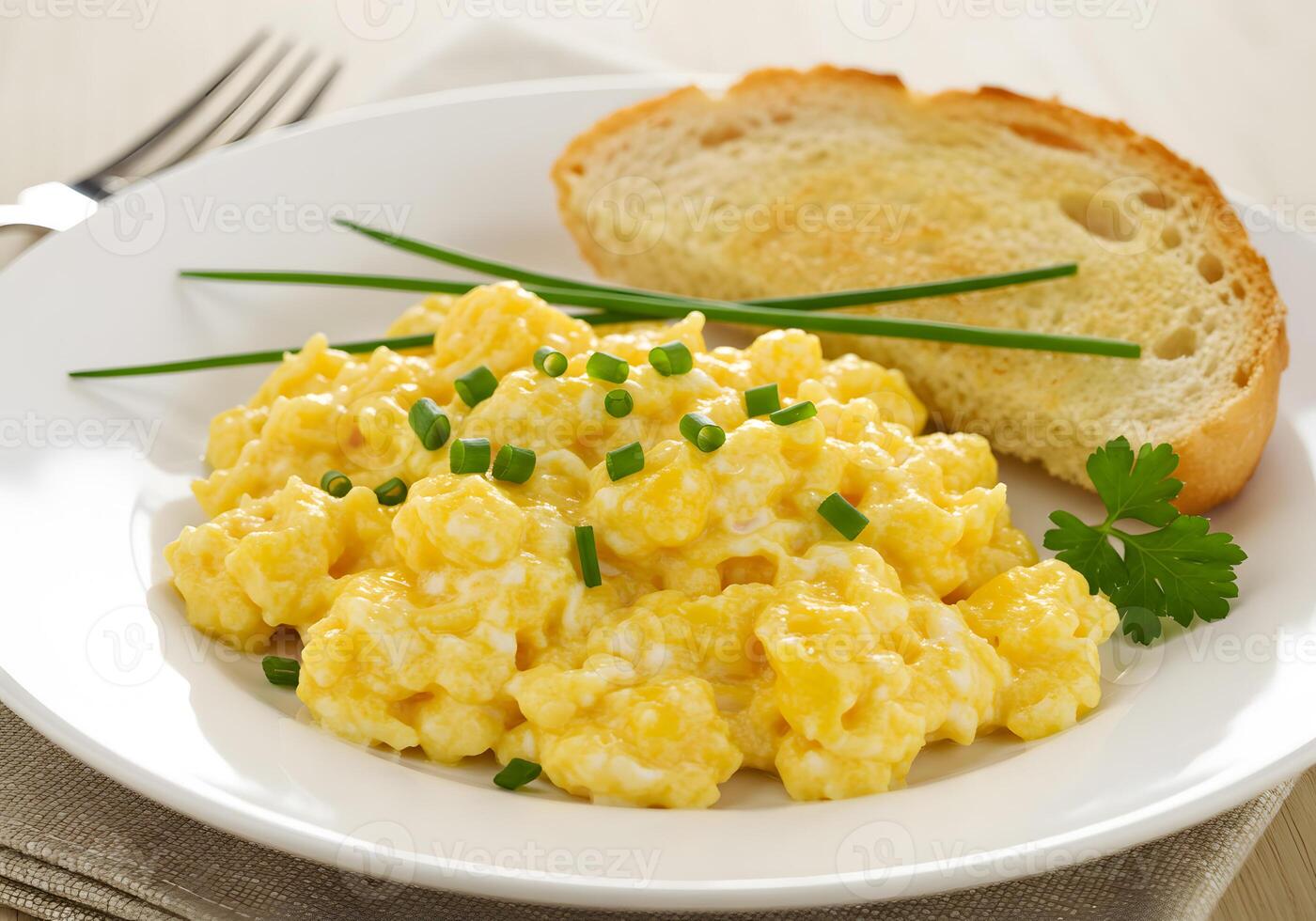 Scrambled eggs with toast on a white plate photo