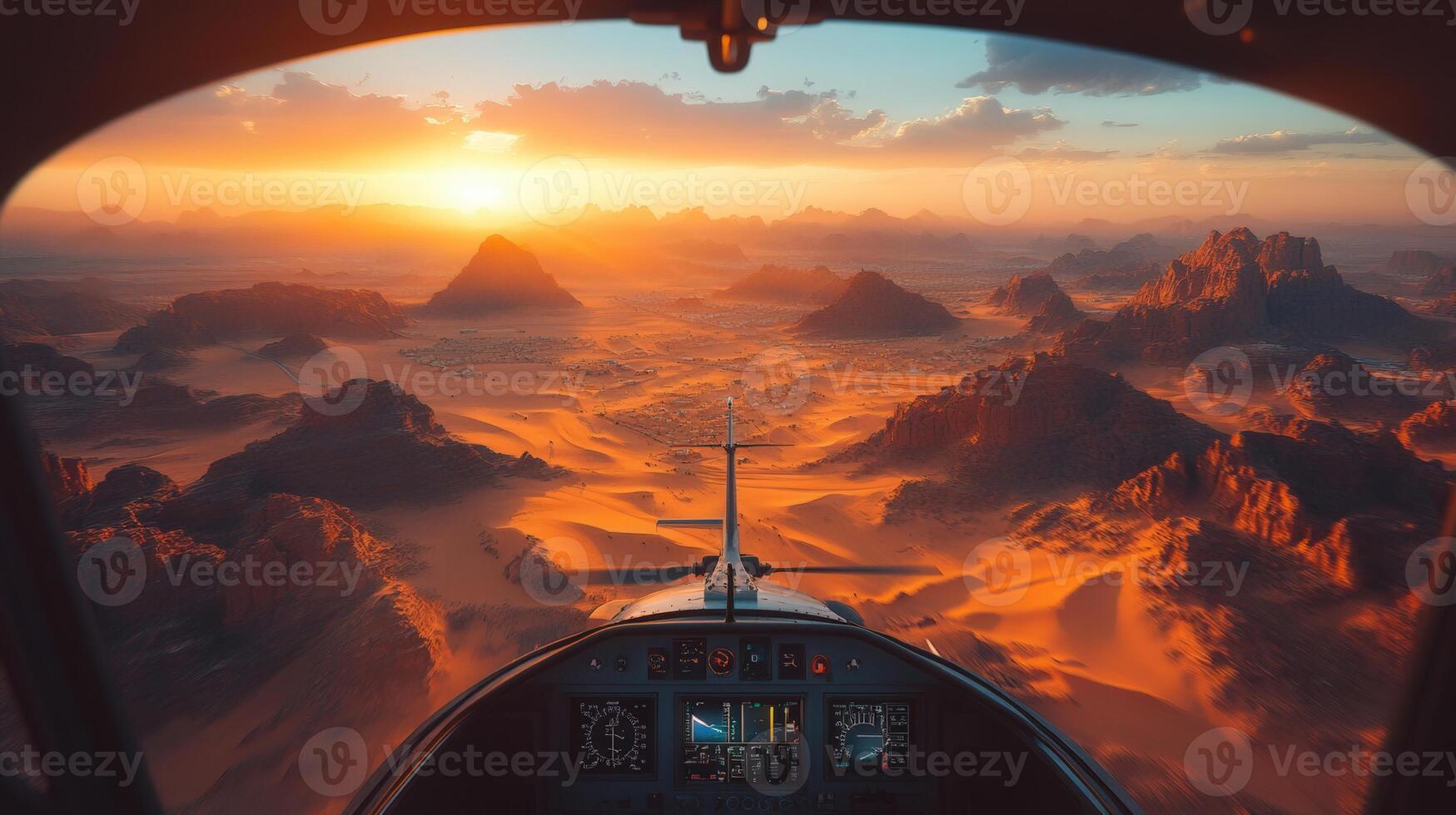 Spectacular view from a plane cockpit, revealing a vast desert terrain at sunset, dramatic and beautiful. photo