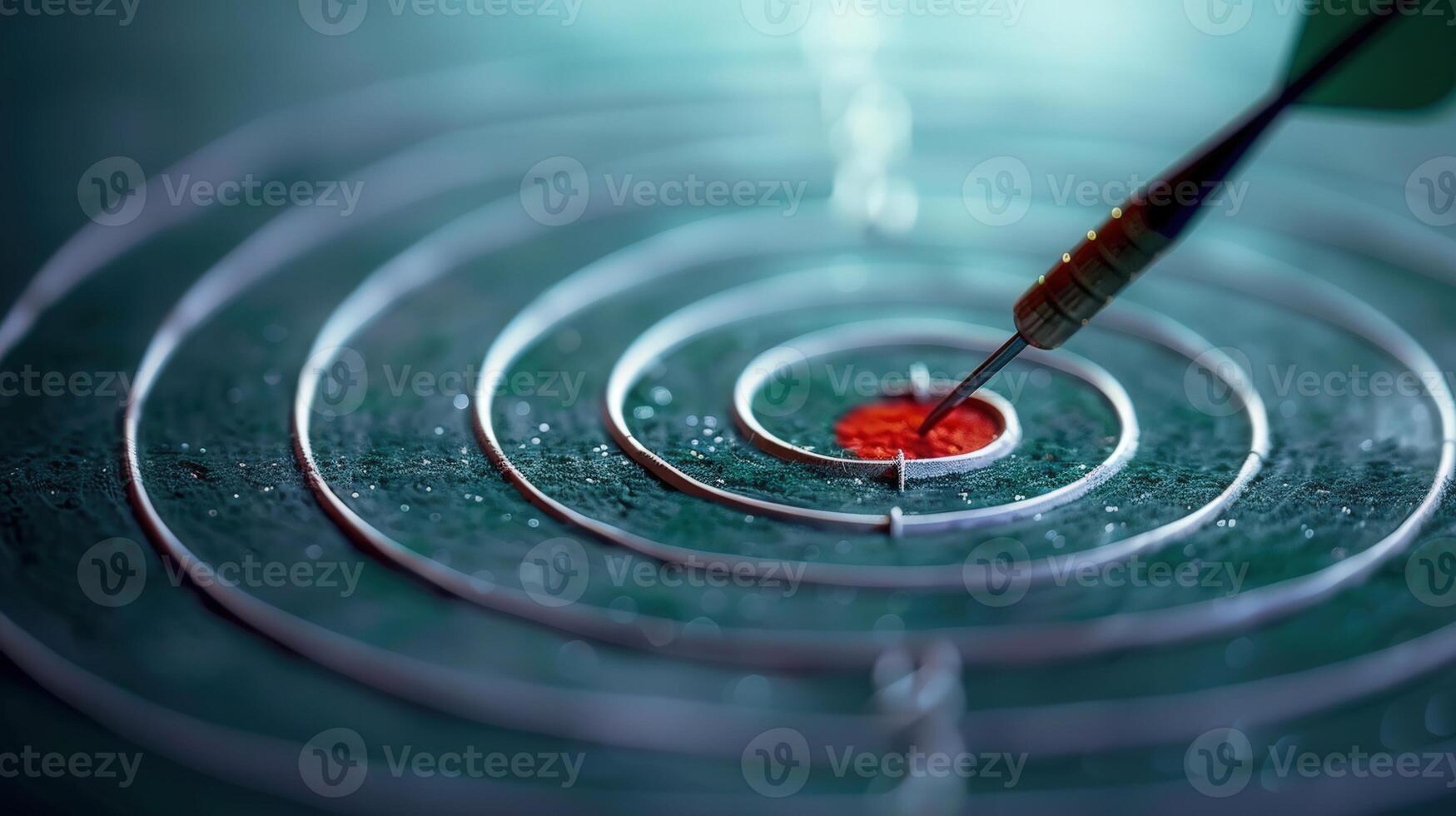 A dart is perfectly placed on the bullseye of a textured target, ready to hit its mark. photo