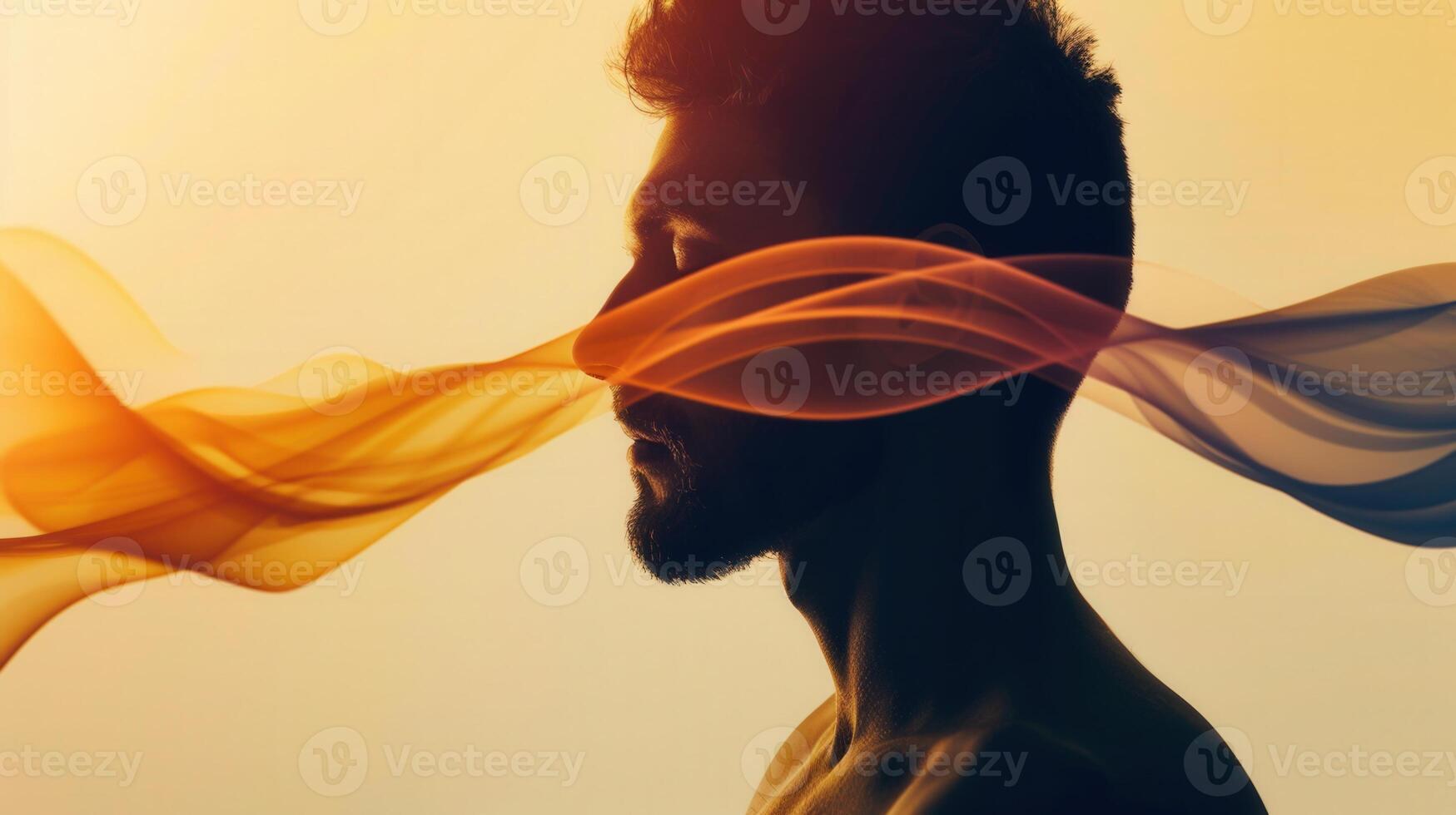 A man's profile, with artistic smoke patterns, against a warm, glowing, and soft background. photo