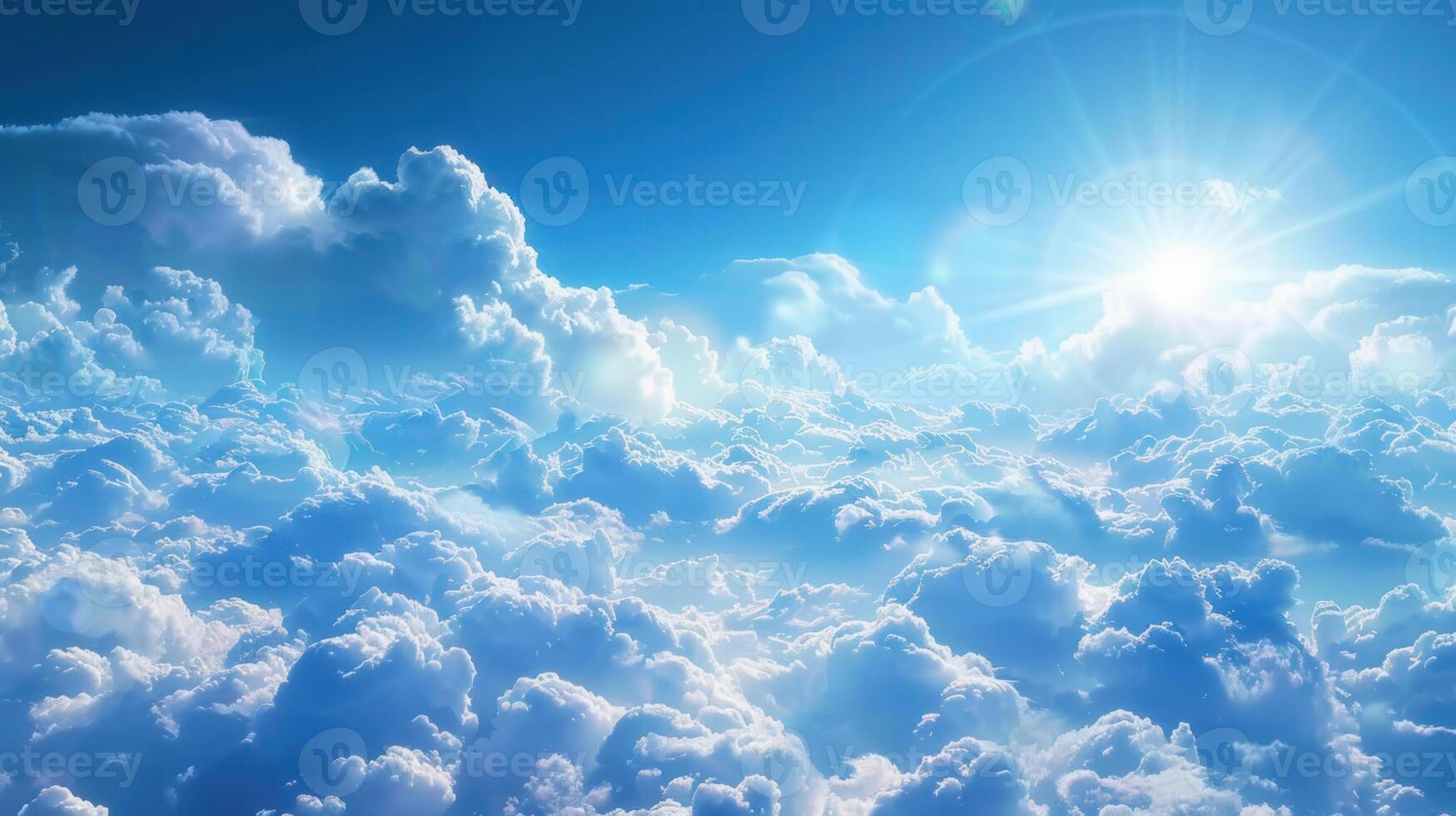 An aerial view of a beautiful, bright blue sky filled with soft, white clouds. photo