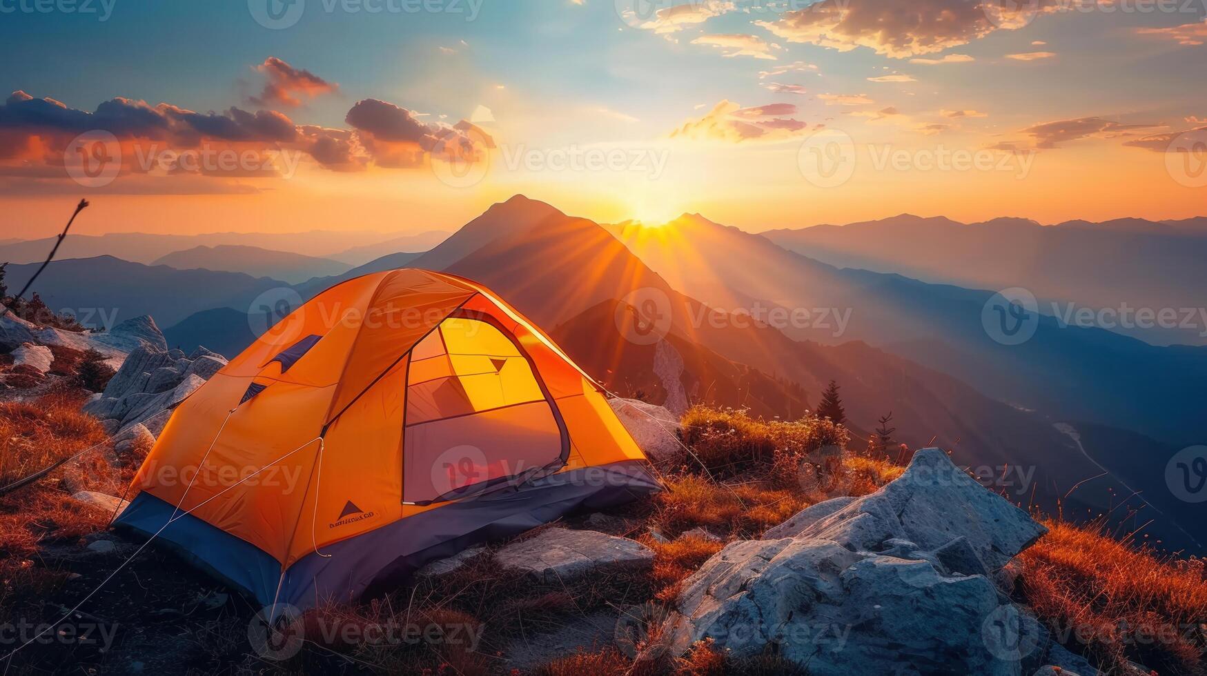 Camping tent on a mountain at sunrise, capturing a breathtaking scenic outdoor experience. photo