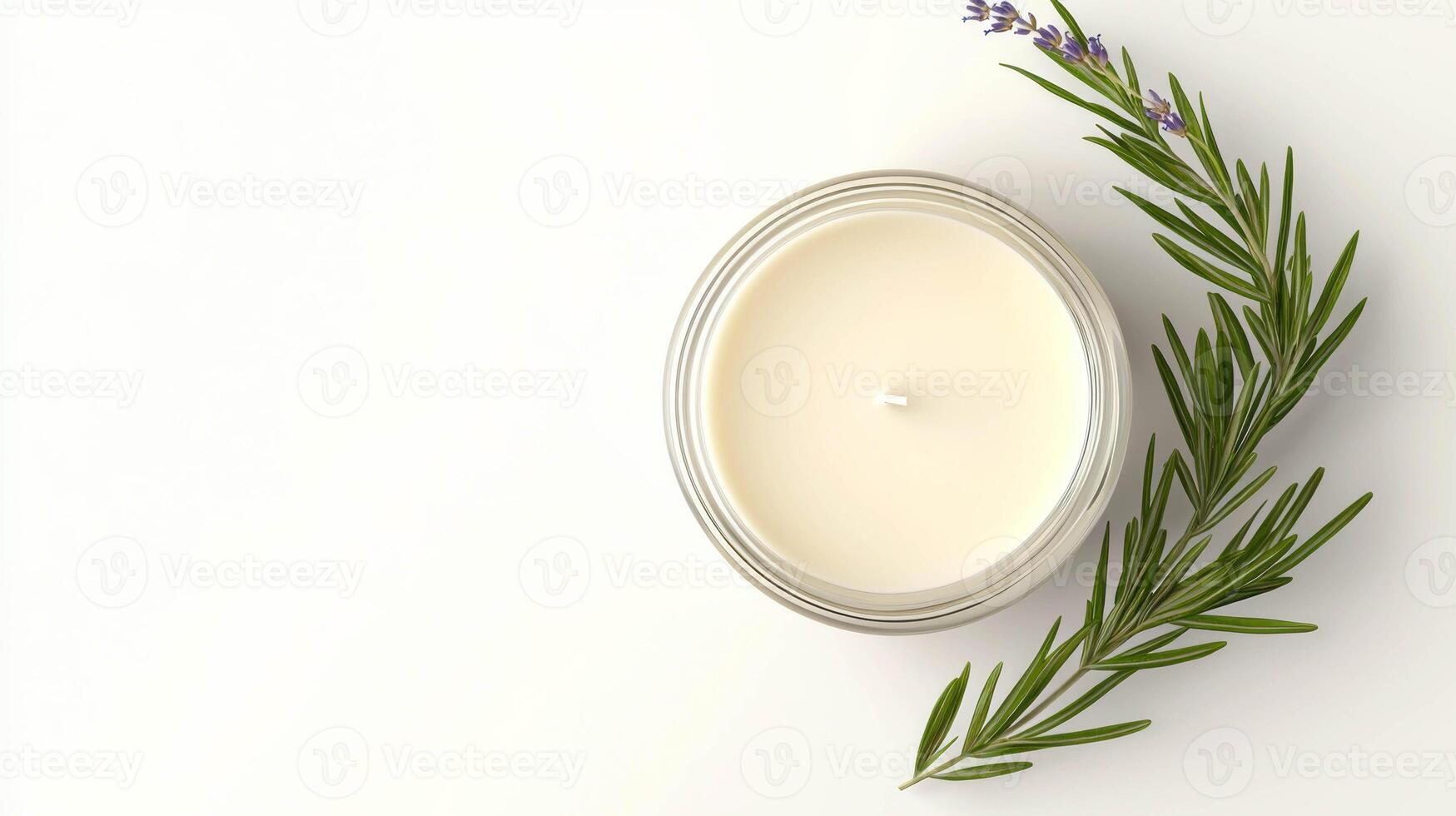 Relaxing lavender candle in glass with fresh sprigs for aromatherapy and home decor photo