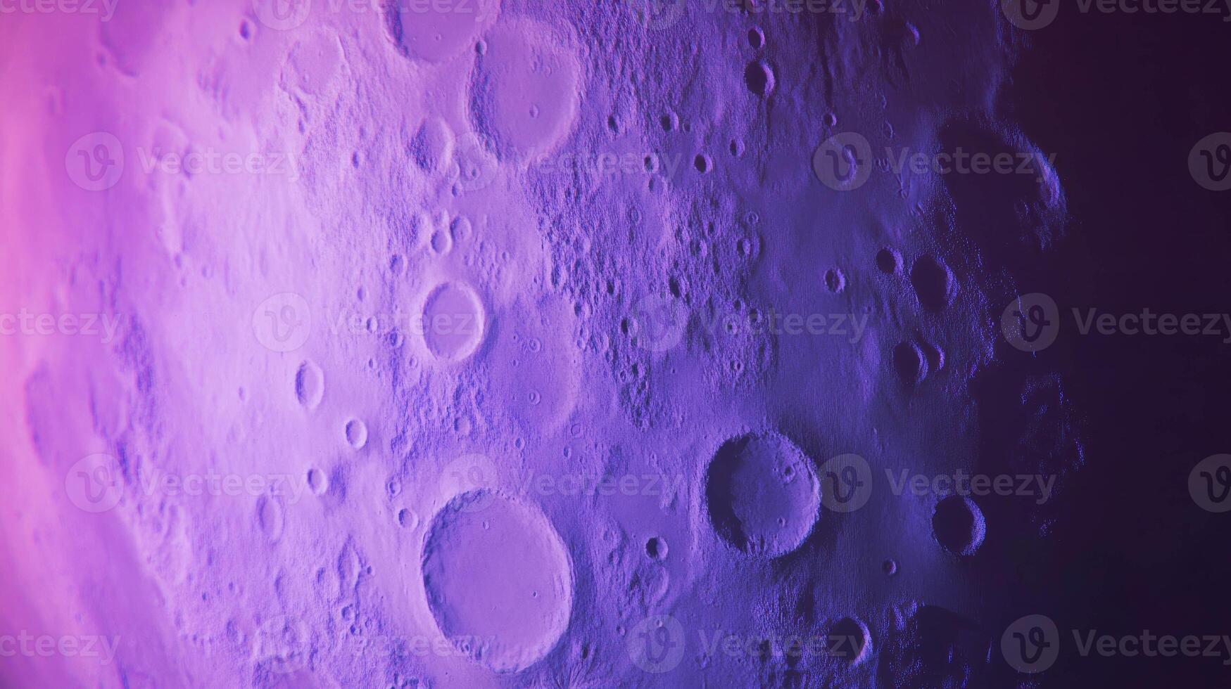 Violet moon texture with chaos abstract crater patterns for background design photo