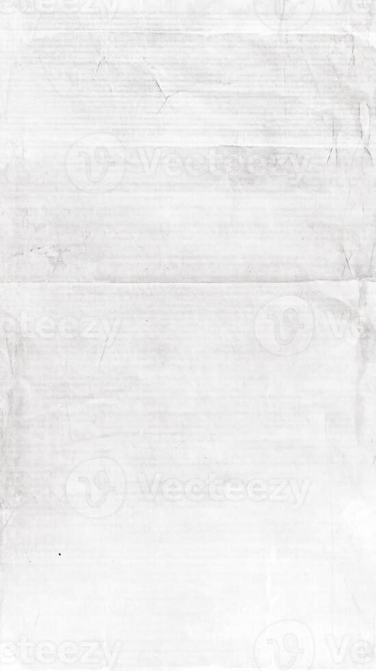 Distressed worn crumpled old paper texture in black and white for vintage design photo