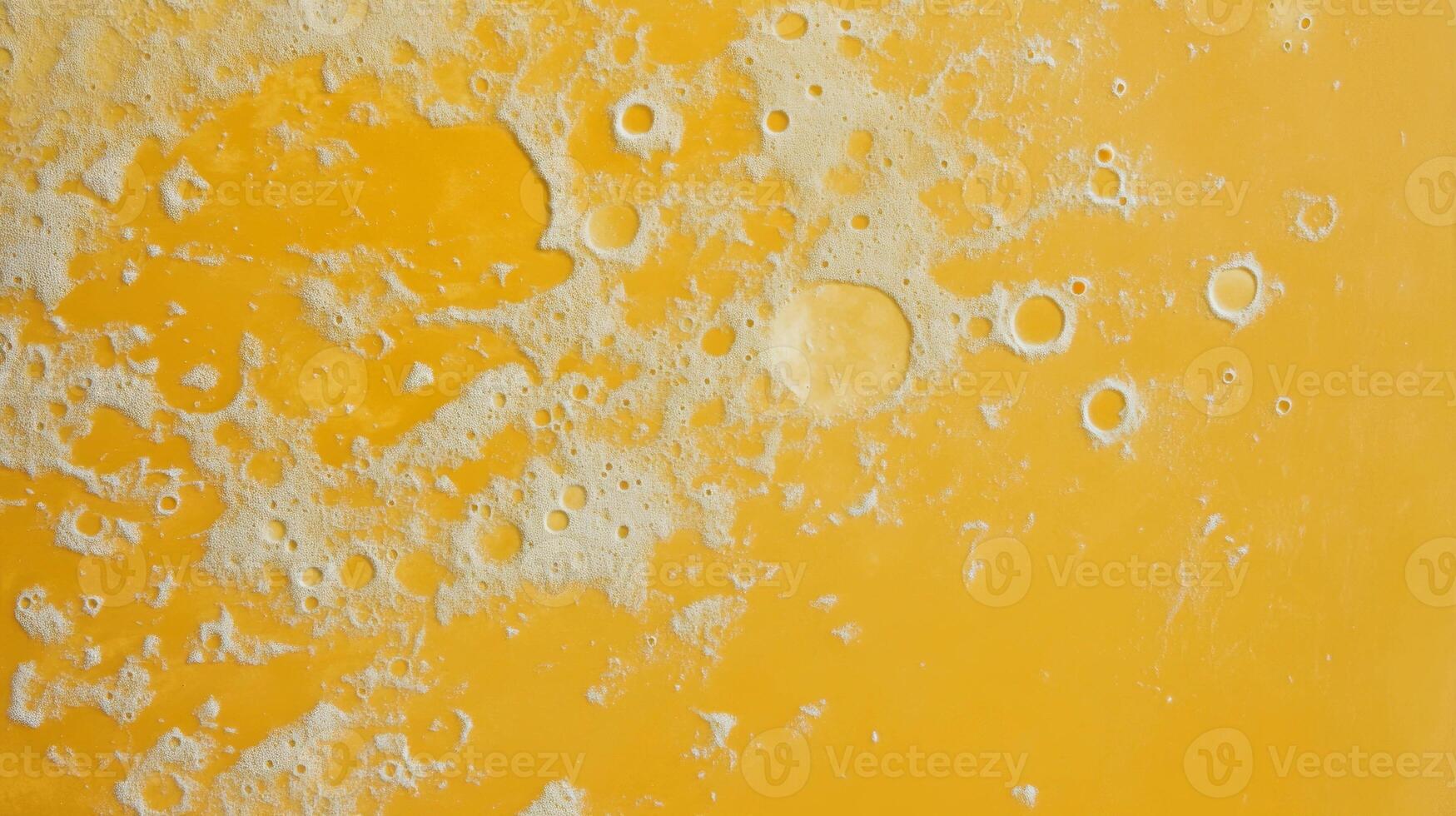 Abstract saffron textured surface with moon-like patterns for creative design photo