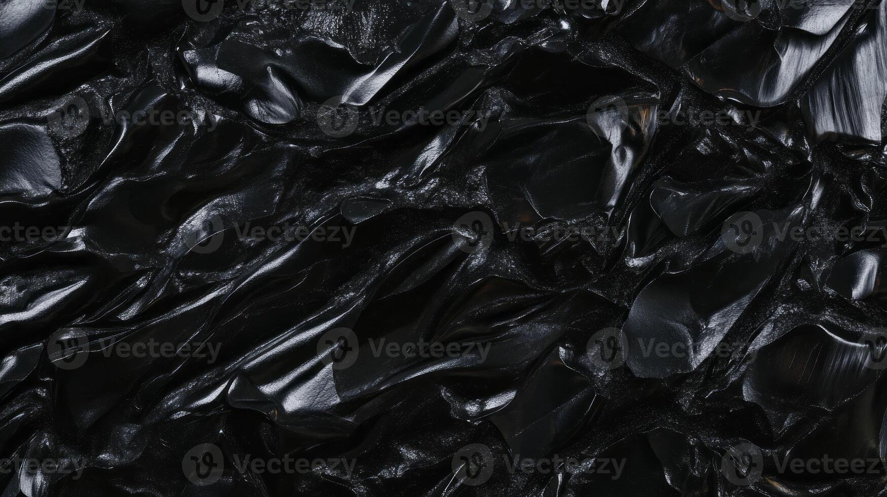Abstract chaotic black texture with moon-like craters for creative design photo