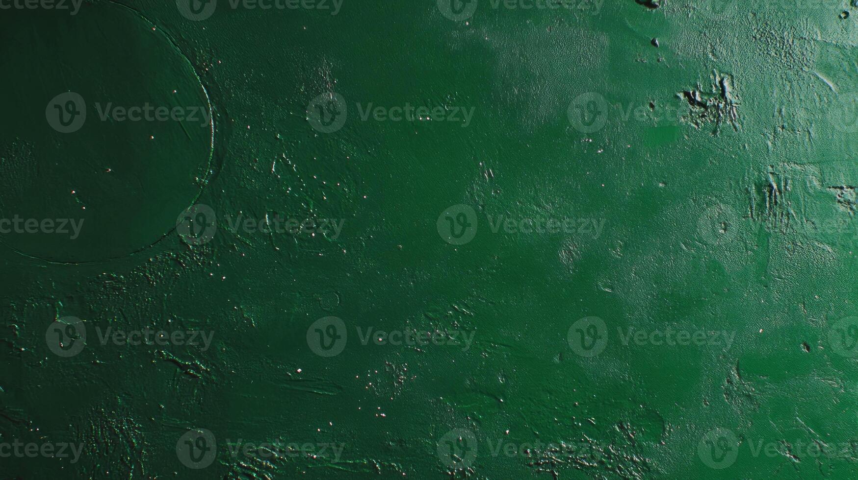 Abstract green surface texture with chaotic patterns and subtle moon-like features photo