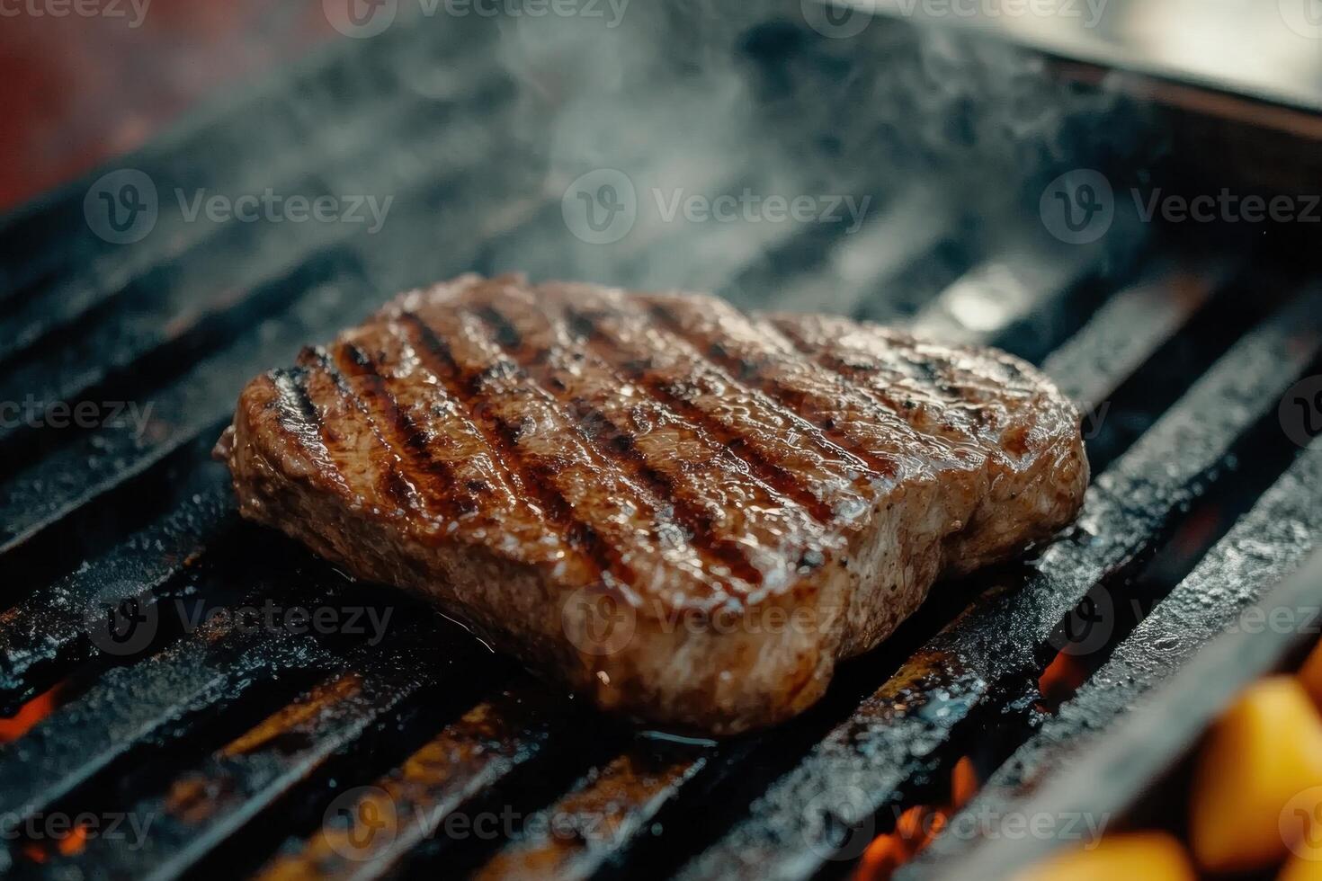 Grilled Steak On The Barbecue Grill Close Up View Of Appetizing Beefsteak Piece photo