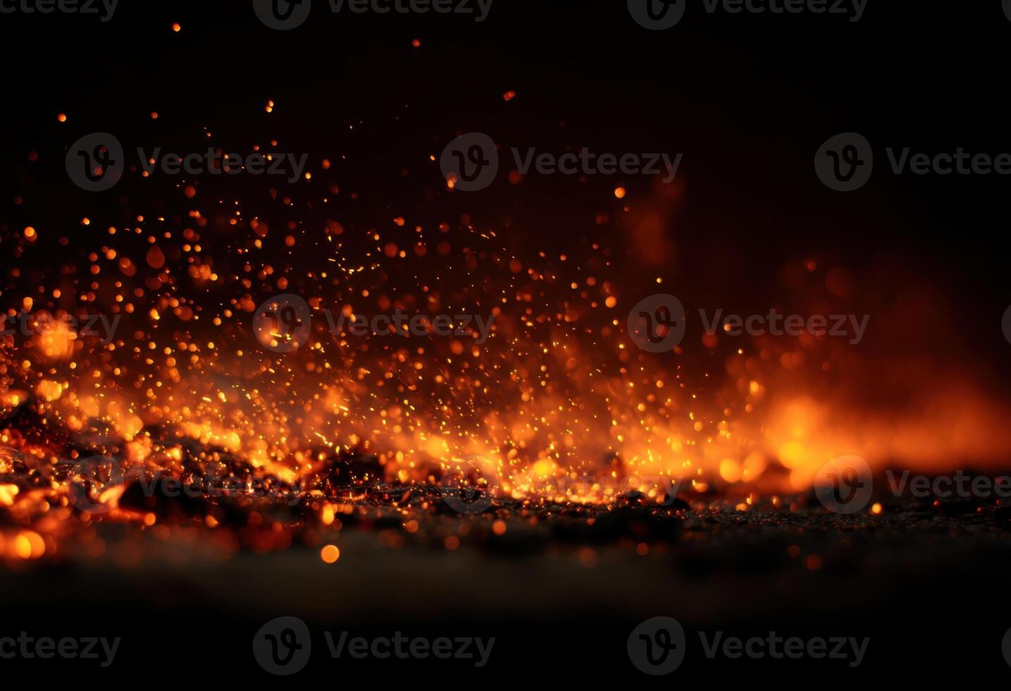 A close up of a fire with sparks and flames photo
