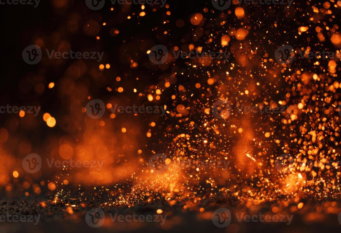 A close up of a fire with sparks flying photo
