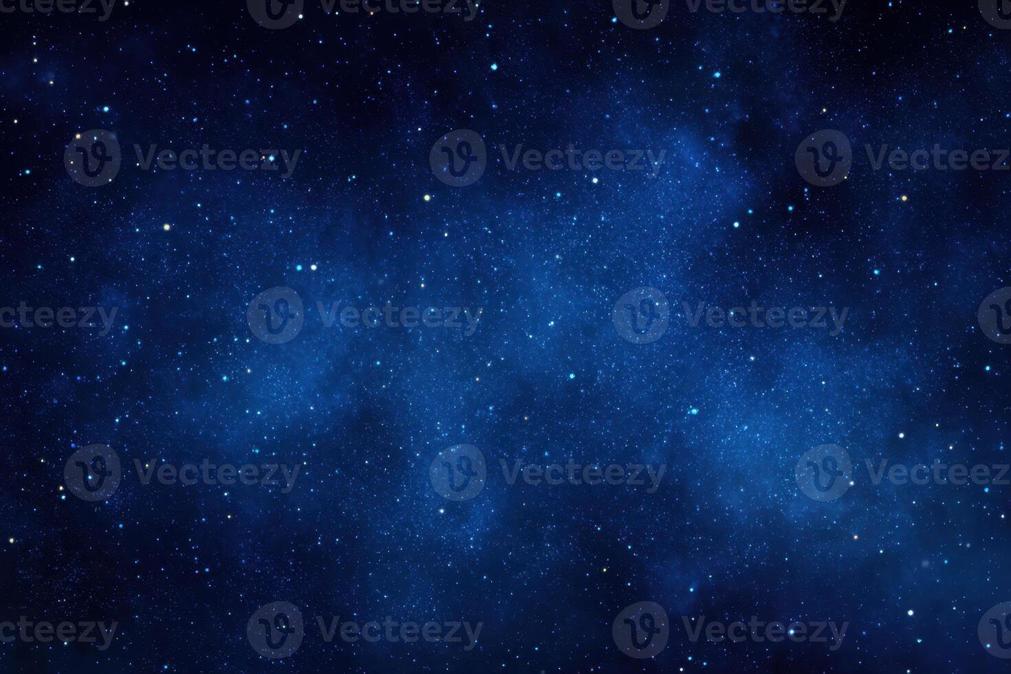 A dark blue sky with stars and a few clouds photo
