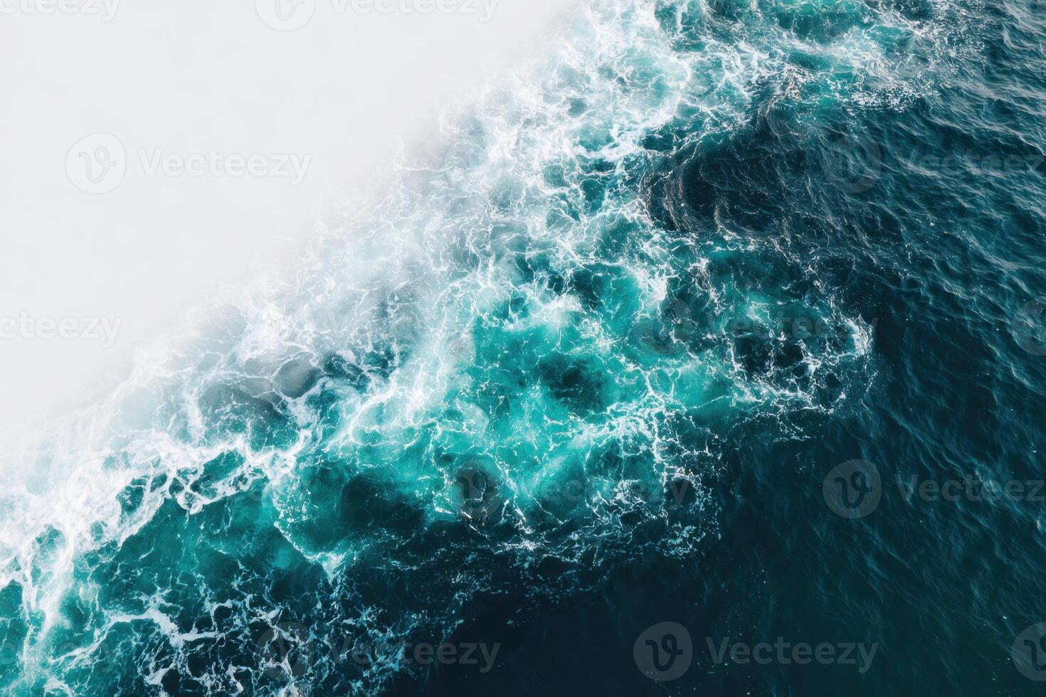 An aerial view of the ocean with waves photo