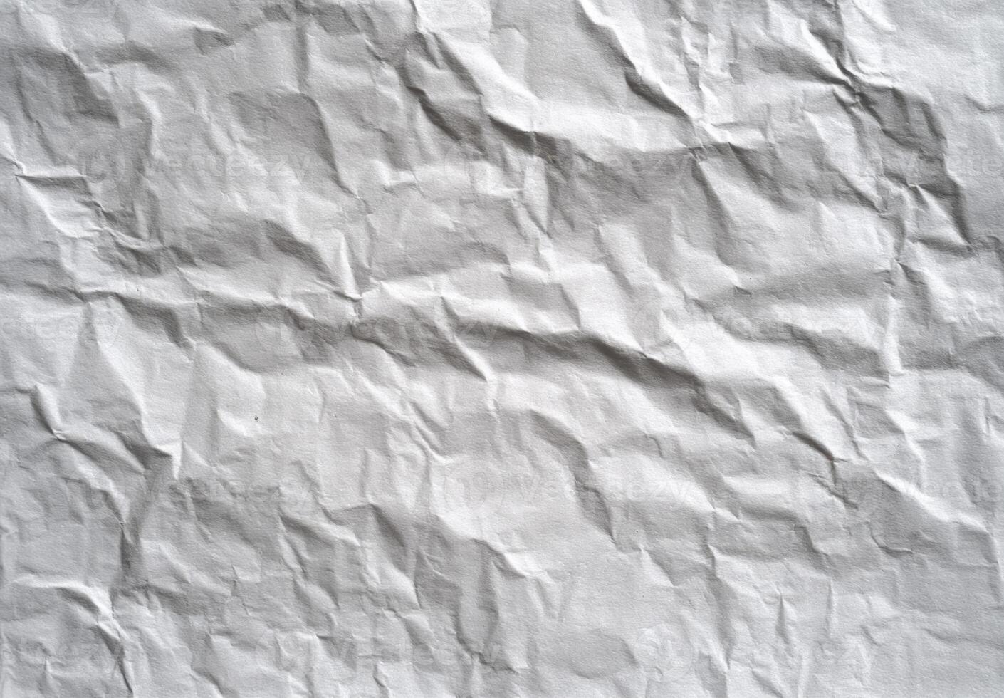 Crumpled Sheet of Paper Texture Close Up Shows Abstract Detail with Wrinkled Design Surface and Interesting Pattern for Creative Background Design photo