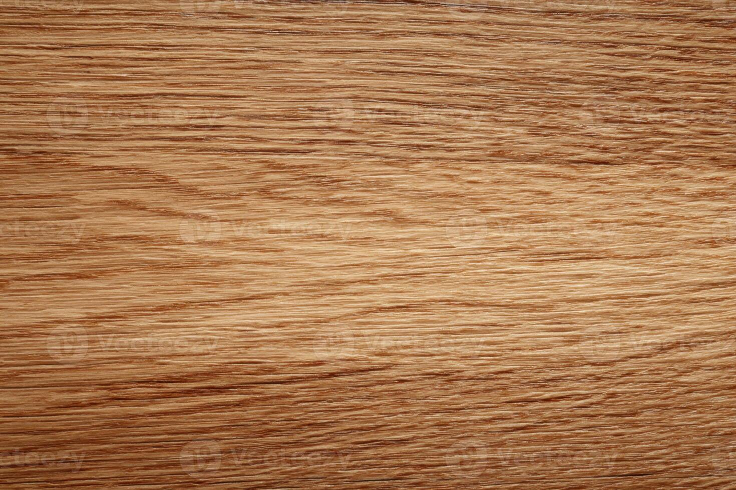 A Natural Textured Surface of Golden Brown Wood Grain Pattern Displaying Fine Details and Organic Lines Creating a Warm and Rustic Feel photo