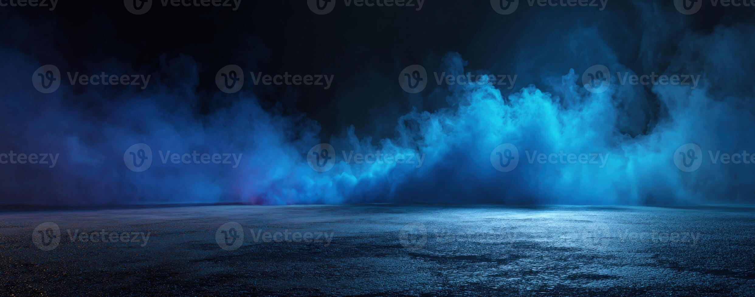 Blue water fountain in the dark with a light shining on it photo