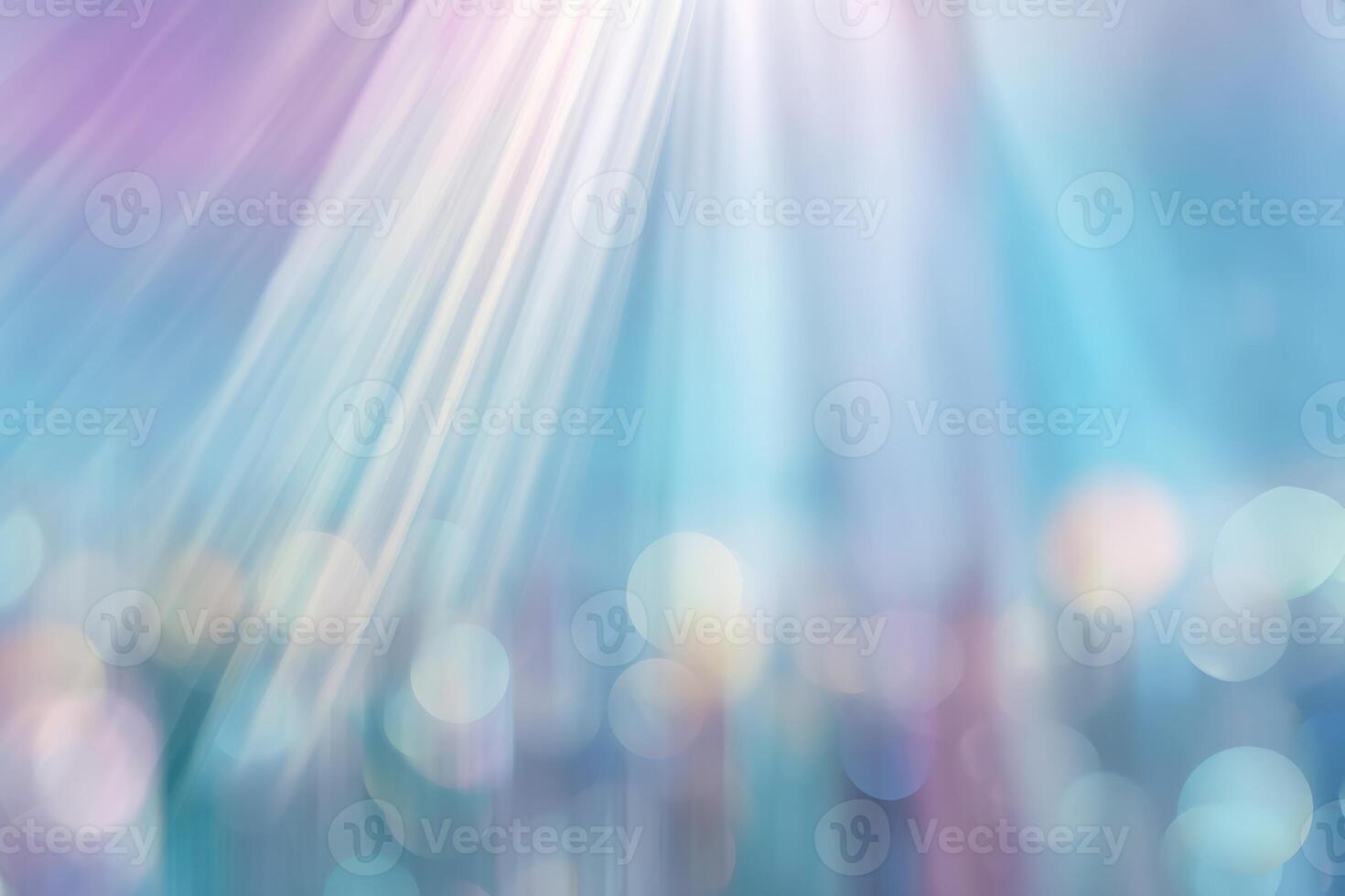 Abstract light beams shining through a blue sky photo