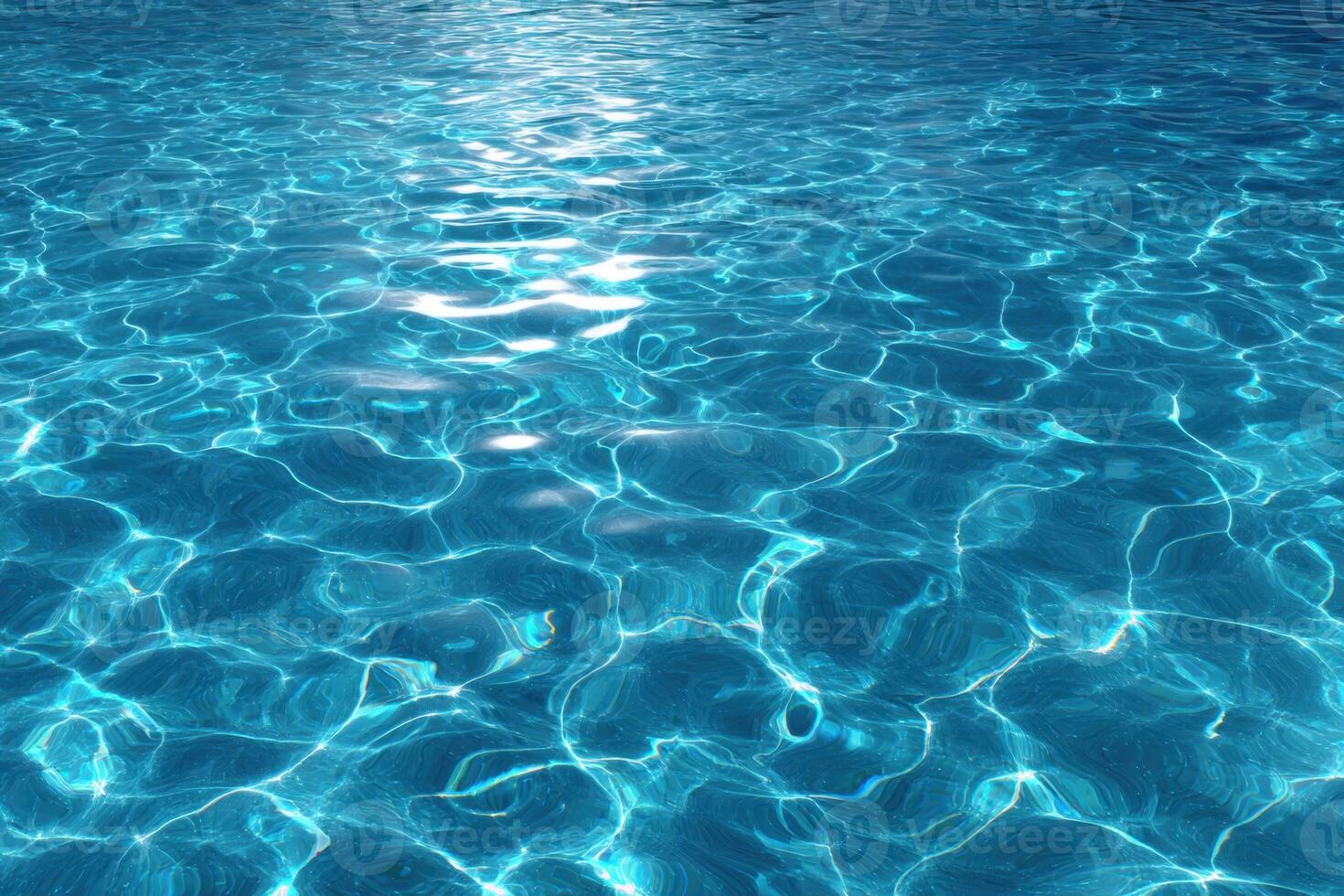 Blue water in a swimming pool with sunlight shining on it photo