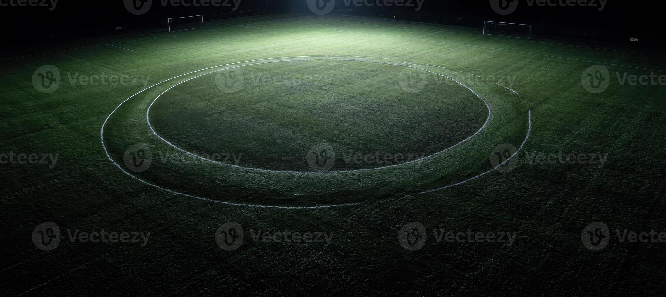 An aerial view of a soccer field at night photo