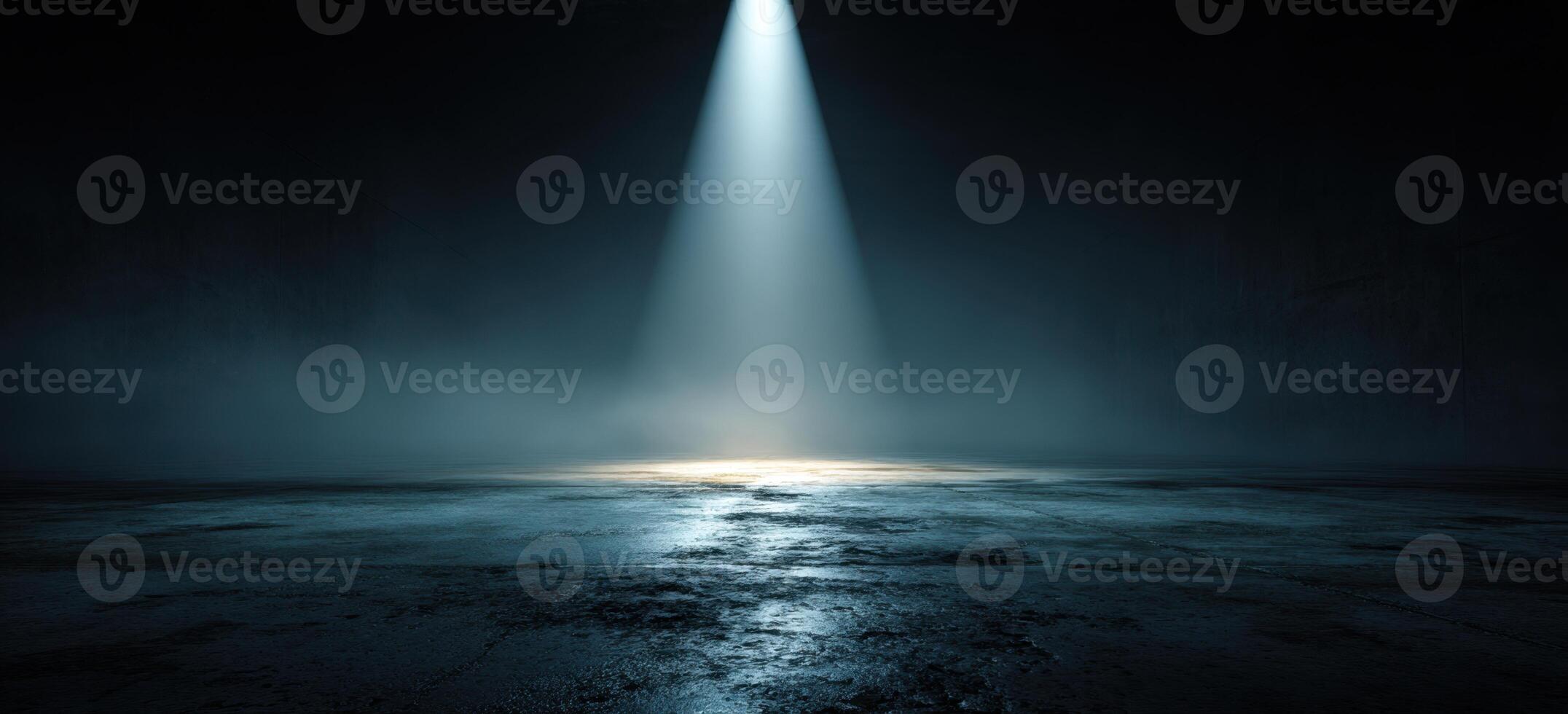 A dark room with a spotlight shining through it photo