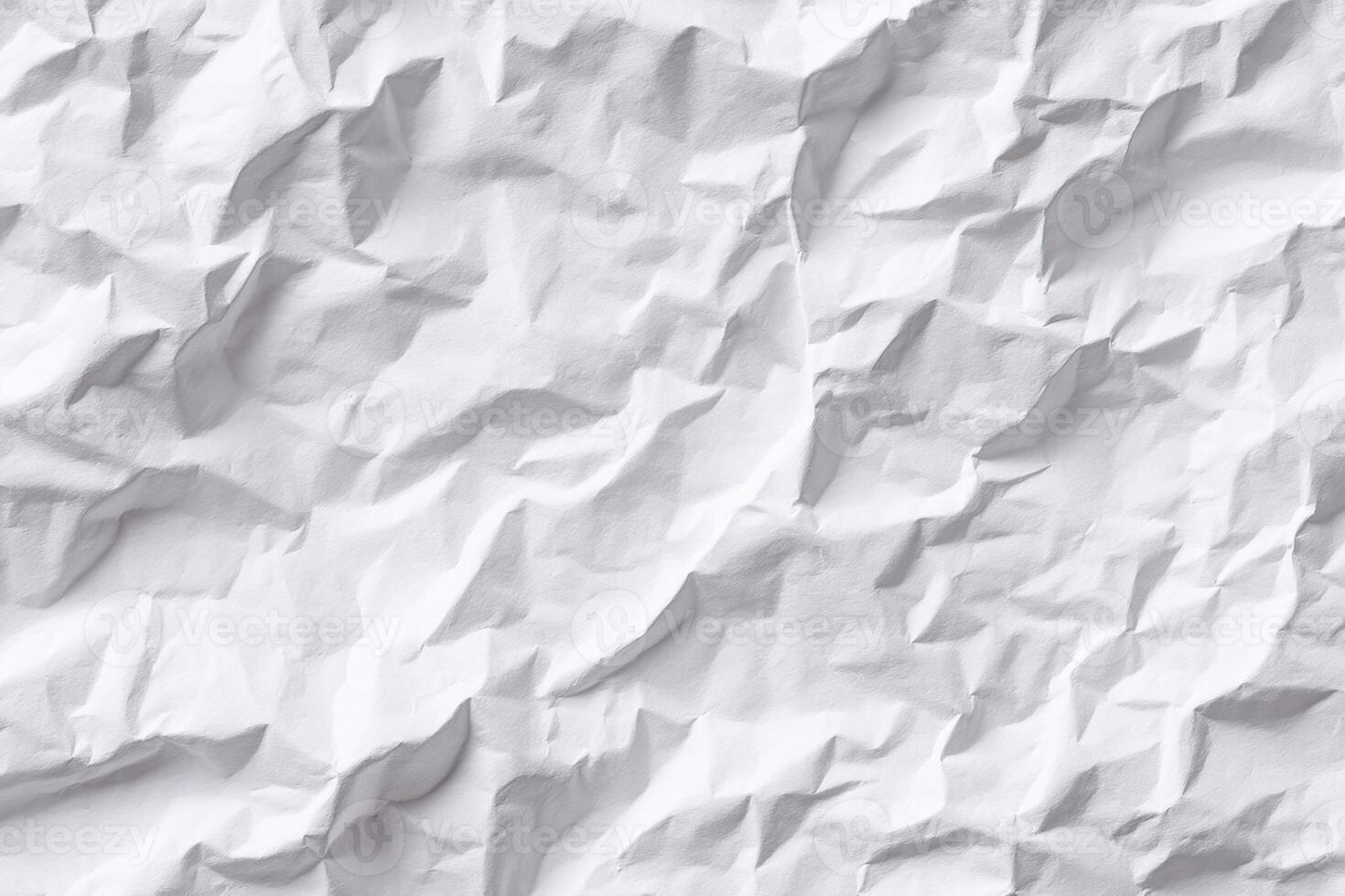 The Intricate Landscape of Wrinkled Paper A Study in Textural Depths and Dynamic Light Play Across a Textured White Surface Embracing Abstract Art photo