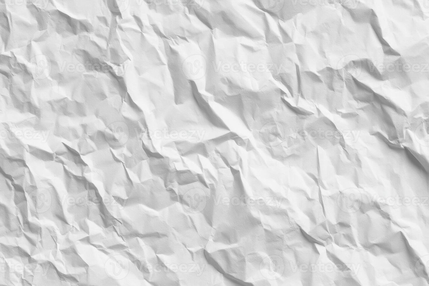 Exploring the Textural Depths of White Crumpled Paper A Study in Light Shadow and Abstract Formations Highlighting the Beauty in Imperfection and Undulating Surfaces photo
