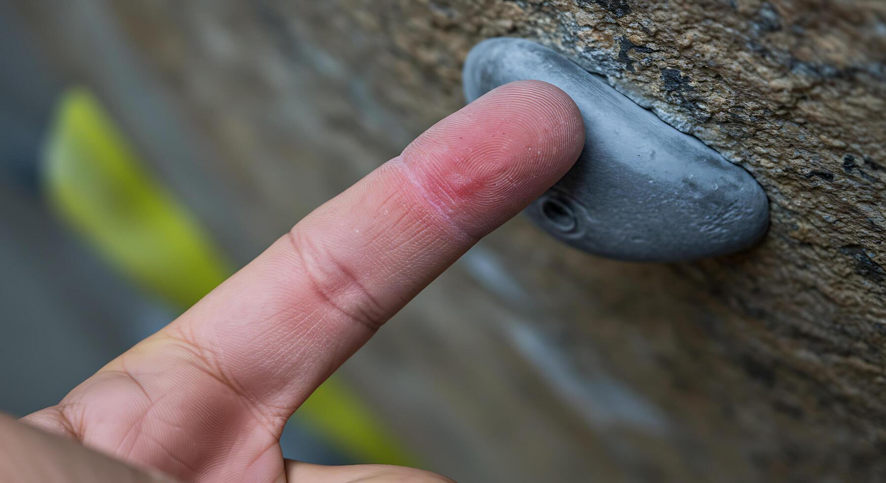 A finger is touching a rock wall photo