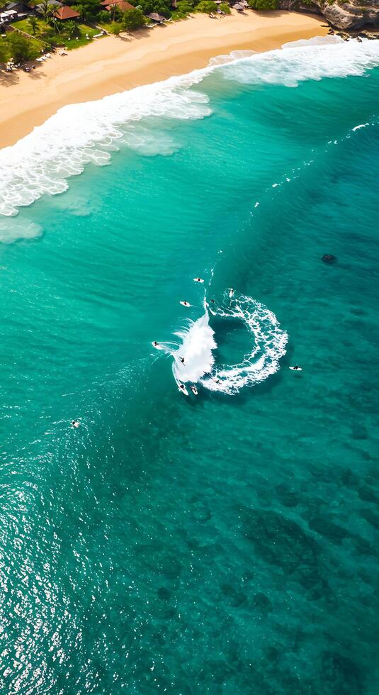 A group of surfers riding waves on a beach photo