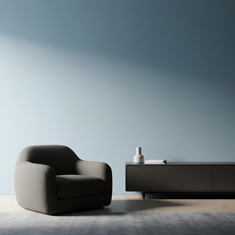 A grey chair and a tv stand in front of a blue wall photo