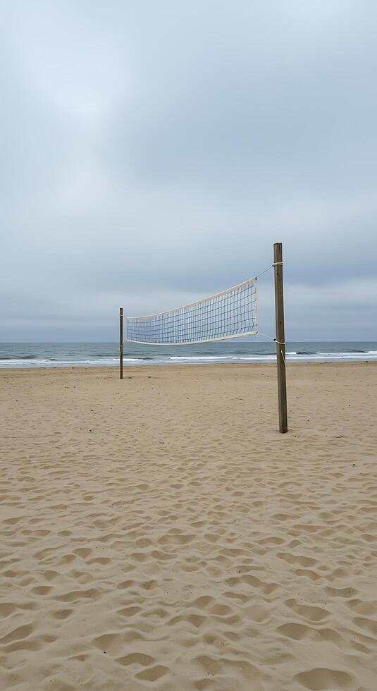 A volleyball net on a beach with sand photo