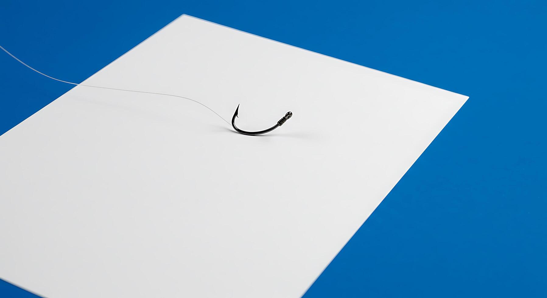 A white piece of paper with a hook attached to it photo
