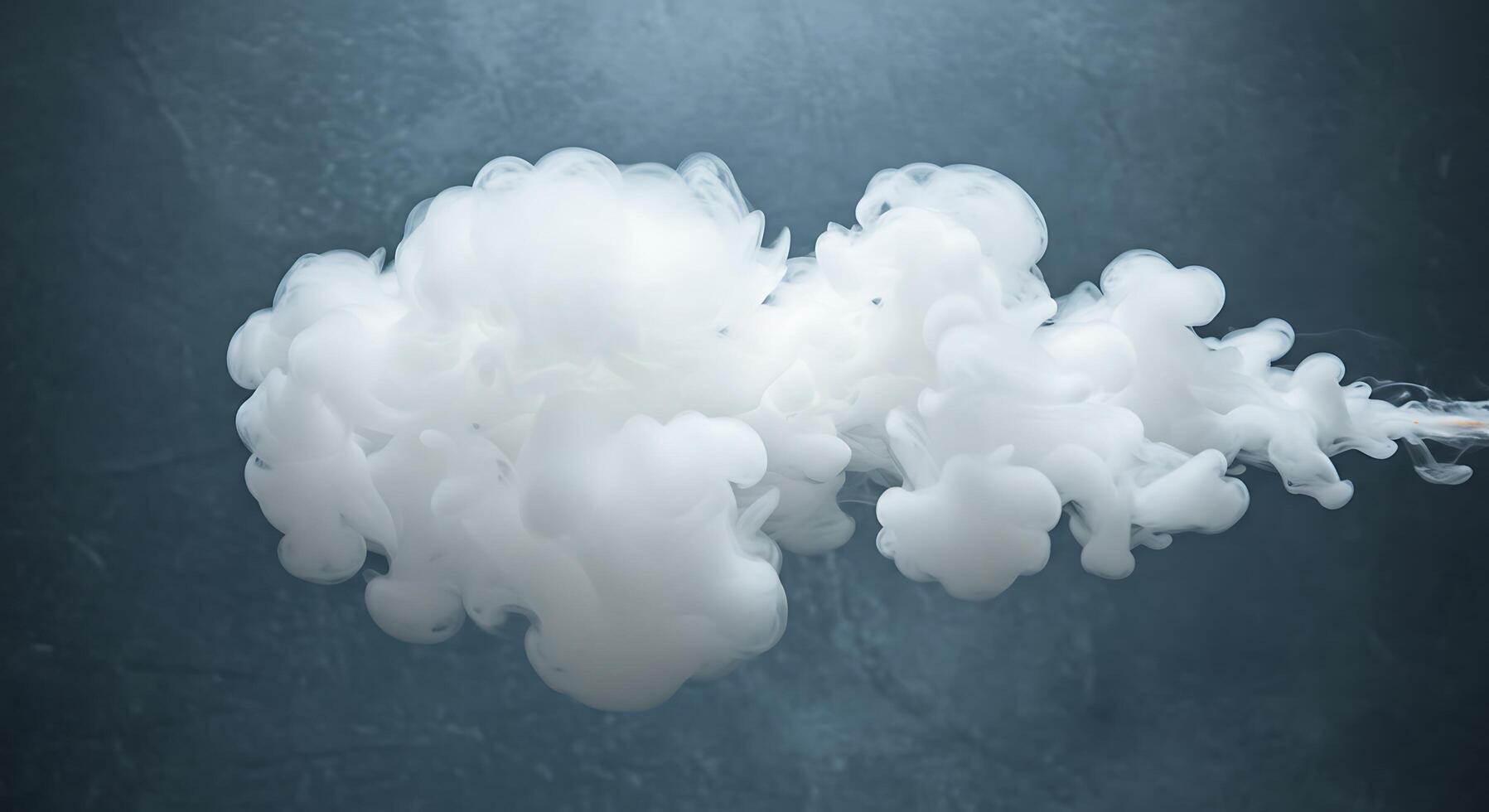 A white smoke cloud is being blown into the air photo