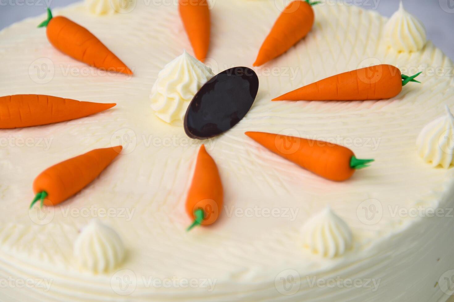 Decorated Carrot Cake, featuring moist and spiced cake layers covered in smooth cream cheese frosting closeup top view of delicious cake photo