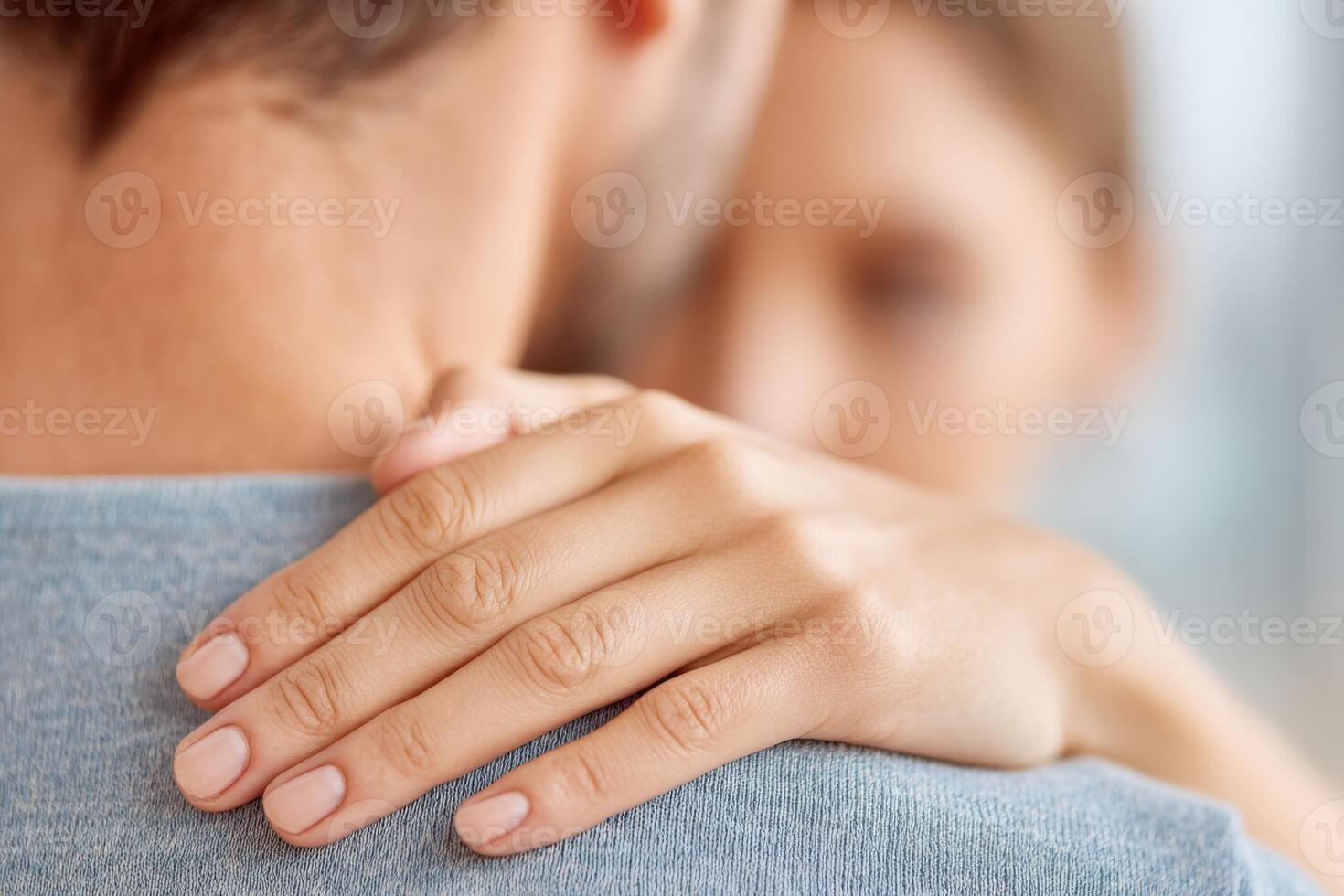Close-up of a gentle touch between a couple, showcasing intimacy and connection, with soft lighting creating a warm and caring atmosphere of affection and support photo